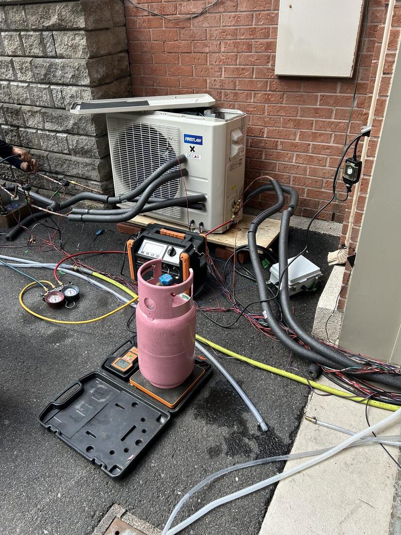 The full driveway rig: unit, manifold, cylinder and instrumentation.