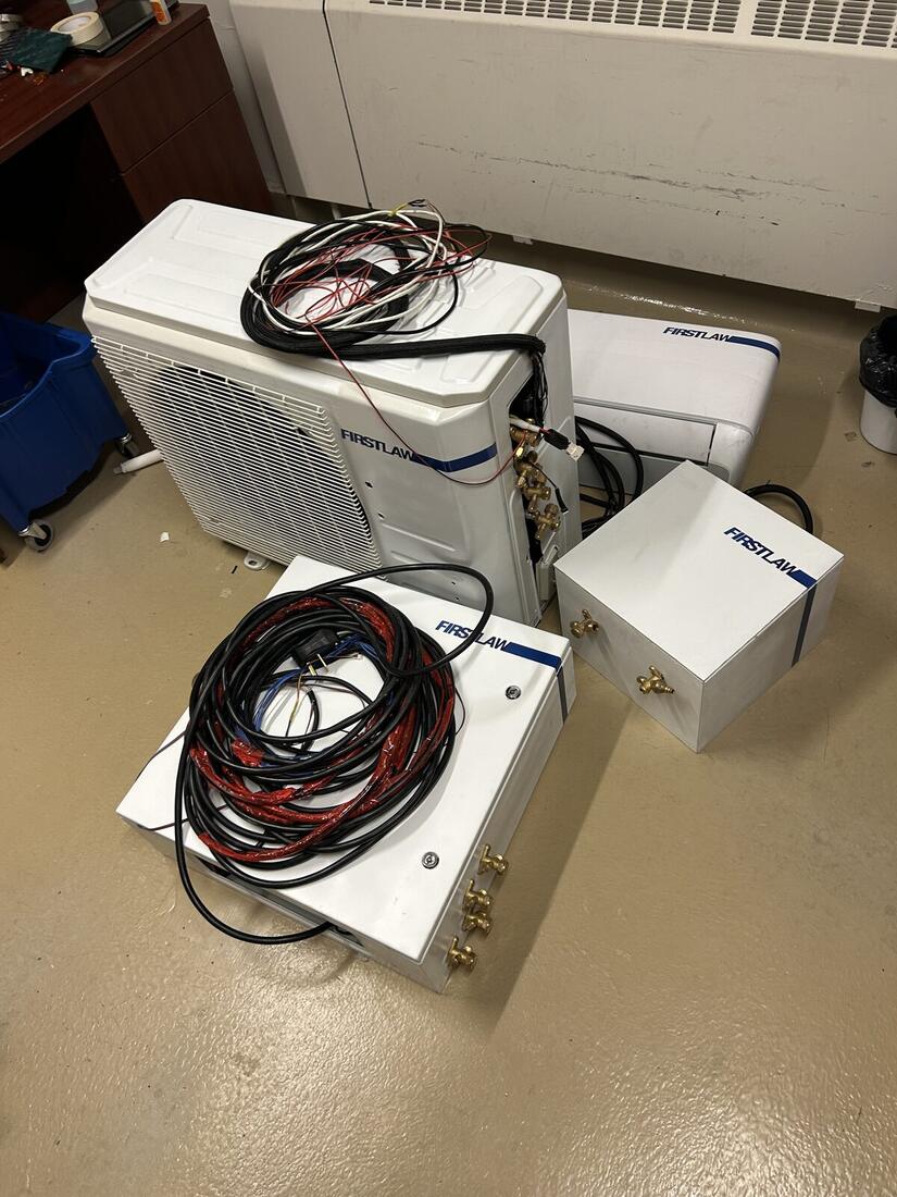 Second-generation hardware laid out during assembly.